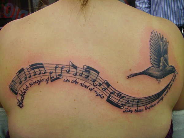 bird with music notes tattoo design idea