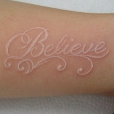 white ink tattoo believe