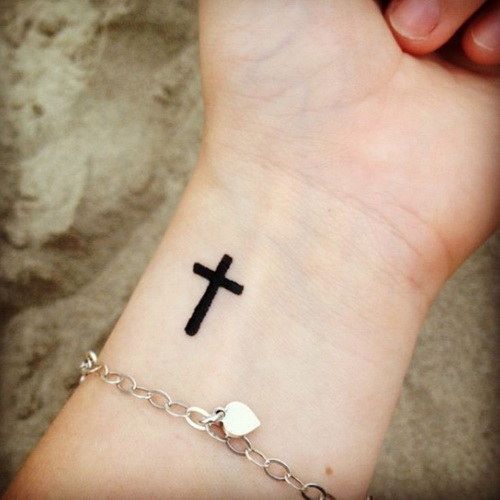 Cross tattoo on wrist
