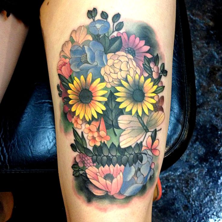 colorful flowers skull tattoo on thigh EntertainmentMesh