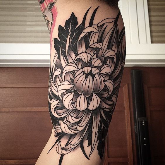Chrysanthemum tattoo on bicep for men