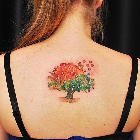 beautiful watercolor bodhi tree tattoo on girl back