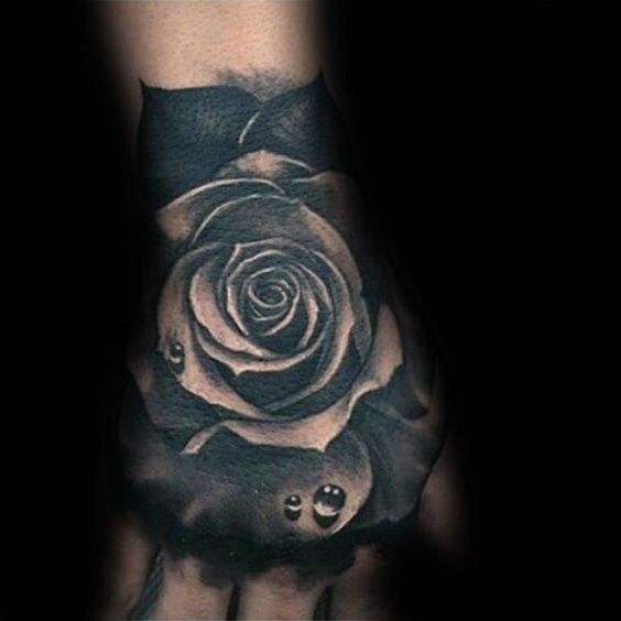black rose flower tattoo on hand for men