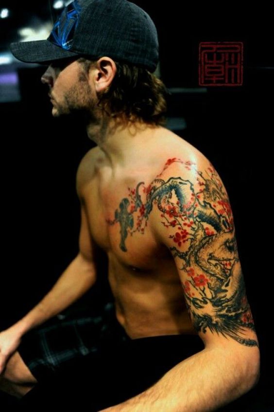japanese dragon with cherry blossom tree tattoo for men chest shoulder and upper sleeve