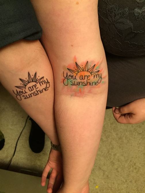 matching tattoo you are my sunshine on forearms