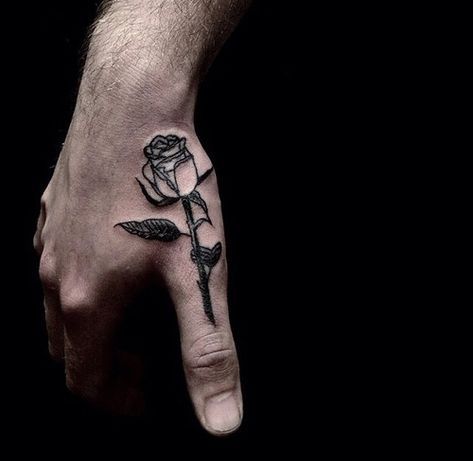 realistic black and white rose flower tattoo on hand for men