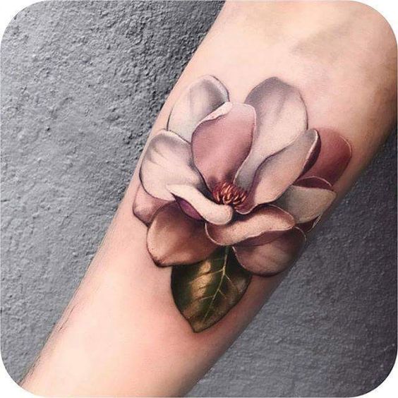 realistic magnolia flower tattoo on men forearm