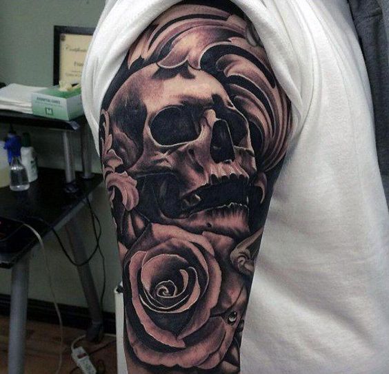 skull and rose tattoo on upper sleeve for men