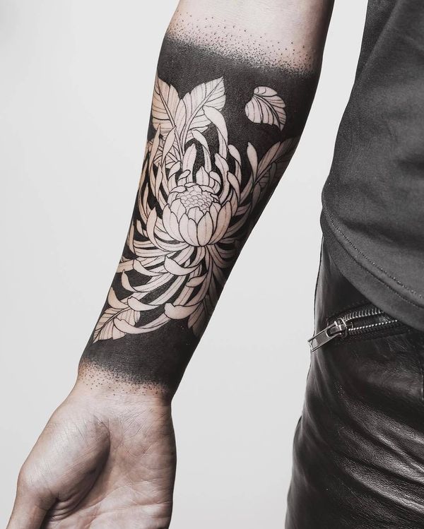 black and white chrysanthemum flower tattoo on men forearm