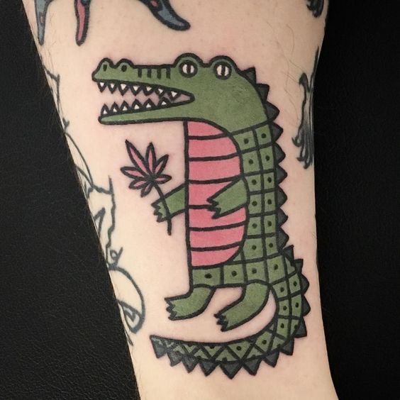 cartoon style minimal crocodile tattoo design