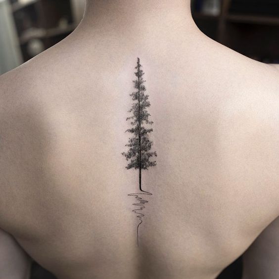 evergreen tree tattoo pattern on spine for females