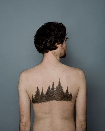 evergreen trees tattoo on back