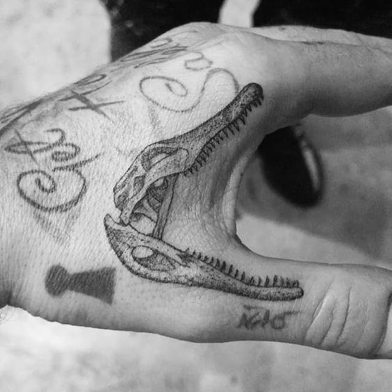 open mouth crocodile skull tattoo design on hand