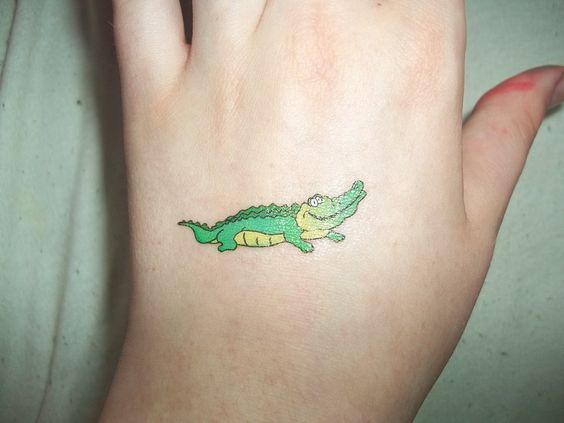 small green alligator tattoo design on hand
