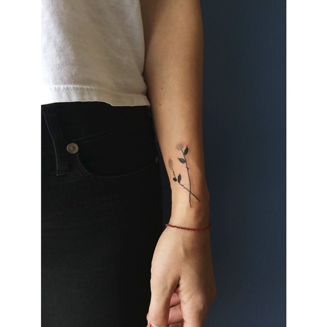 tiny flower tattoos on forearm wrist