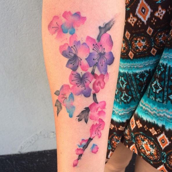 watercolor Georgia flower branch tattoo on forearm