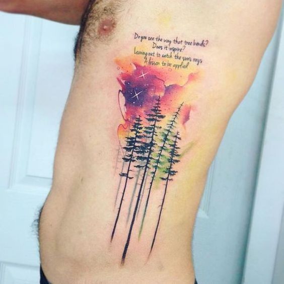 watercolor pine trees tattoo on side ribs for men