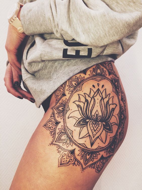 side thigh lotus flower tattoo