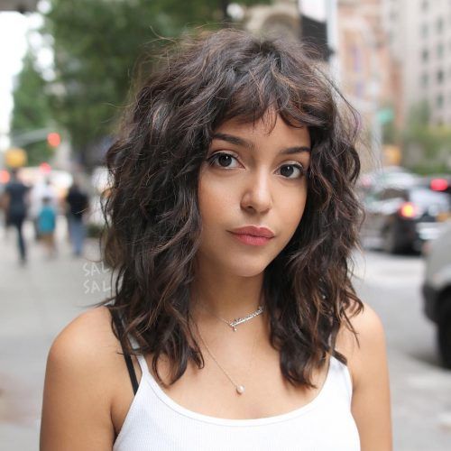 long layered curly shoulder length hairstyle