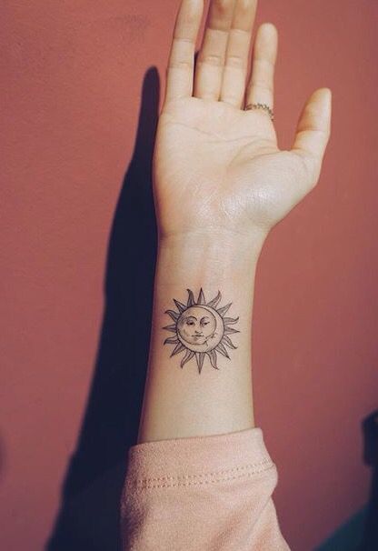 sun and moon tattoo design on wrist