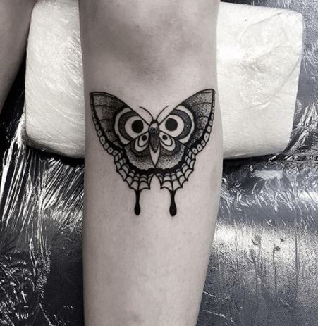 butterfly tattoo under knee