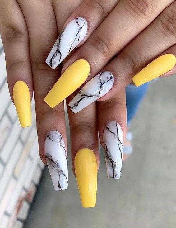 yellow nails with marble designs