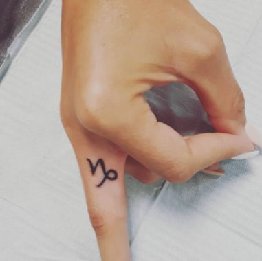 capricorn symbol tattoo ideas for finger