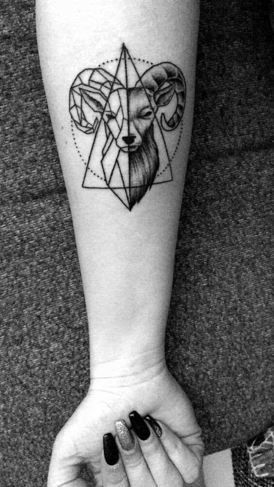 goat head inside a triangle tattoo design on forearm