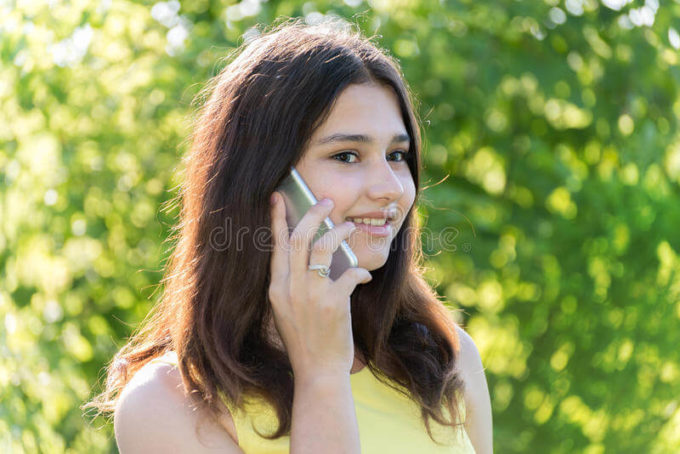cute girl chatting on phone the thing that guys love the most