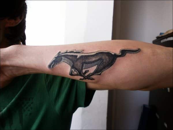 ford mustang logo tattoo on forearm