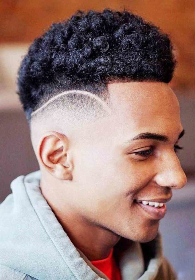 bald fade afro with separation line design
