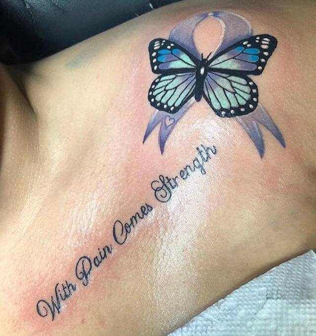 cancer ribbon with butterfly and with pain comes strength tattoo on collarbone