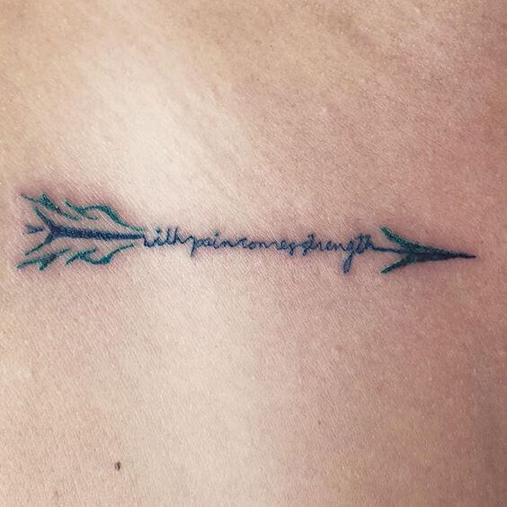 with pain comes strength tattoo design inside arrow