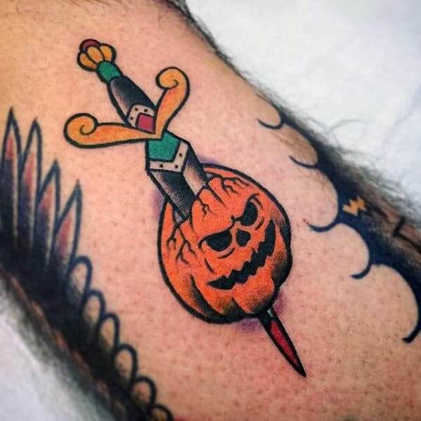 dagger inside pumpkin halloween tattoo design