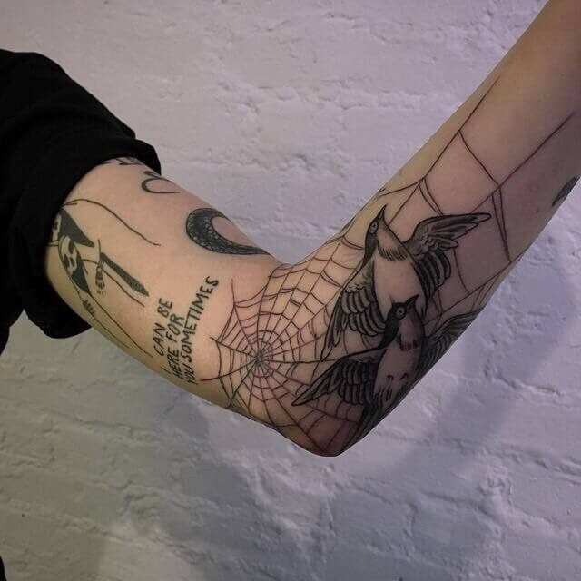 inner arm spider web tattoo