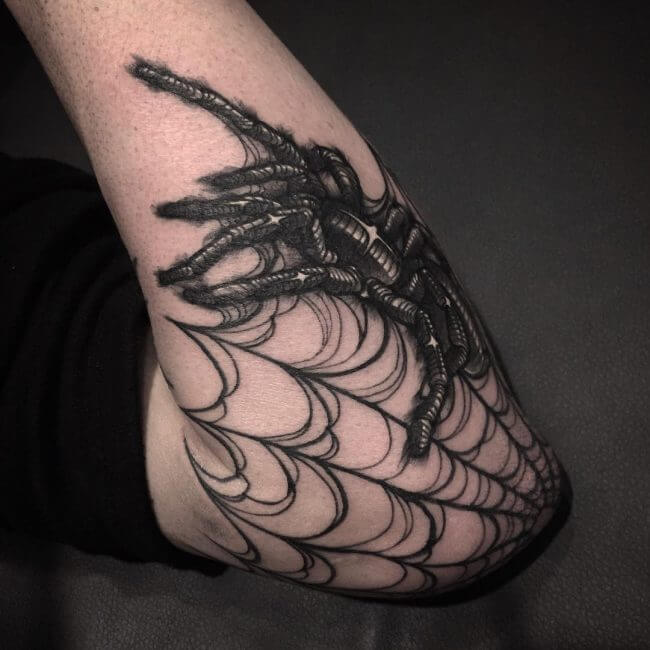 men spider web tattoo idea for elbow