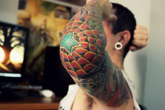 neo traditional spider web tattoo design on elbow