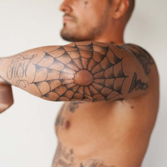 spider web elbow tattoo idea