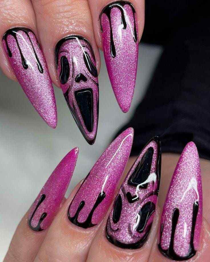 black and pink halloween nails