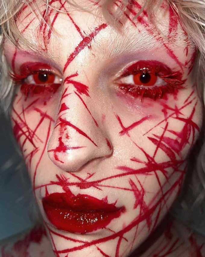 bloody Halloween makeup with facial slashes for a spooky Halloween look