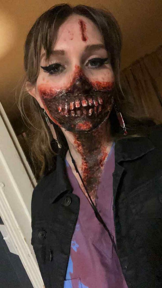 bloody Halloween makeup featuring zombie look for spooky horror look at night